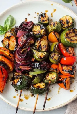 Colorful plate of balsamic grilled vegetables including zucchini and bell peppers