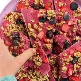 Delicious berry granola yogurt bark topped with fresh berries and granola