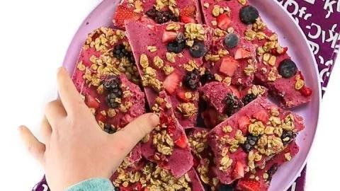 Delicious berry granola yogurt bark topped with fresh berries and granola
