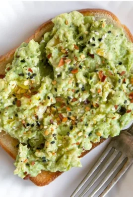 Delicious plate of the best avocado toast with fresh ingredients