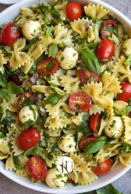 Colorful Bow Tie Pasta Salad with vegetables and dressing