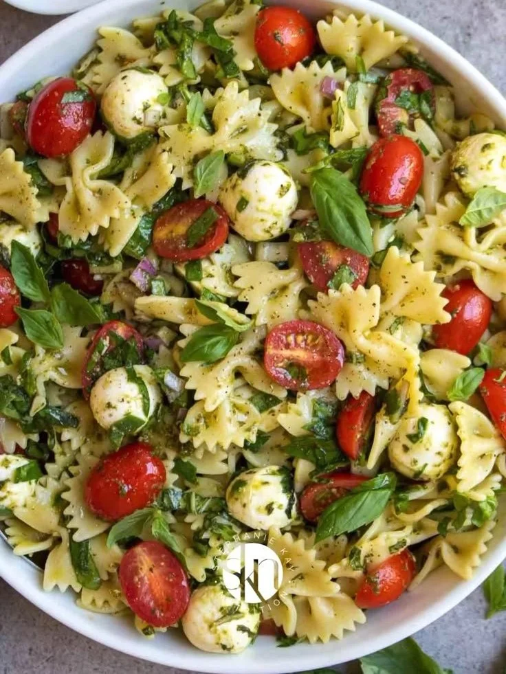 Colorful Bow Tie Pasta Salad with vegetables and dressing