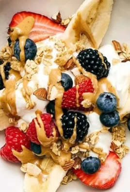 Healthy Breakfast Banana Split with fruits and yogurt
