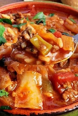 Bowl of cabbage soup with ground beef and vegetables