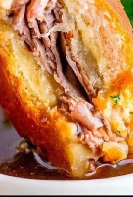 Delicious French Dip Sliders served with au jus for dipping