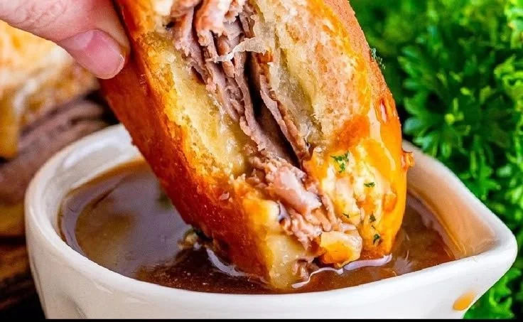 Delicious French Dip Sliders served with au jus for dipping