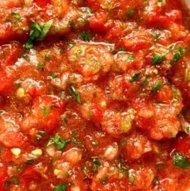 A bowl of fresh homemade salsa with colorful ingredients