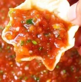 Delicious homemade restaurant-style salsa recipe ingredients and finished dish.