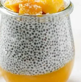 Mango Coconut Chia Pudding topped with fresh mango and coconut flakes
