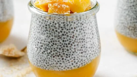 Mango Coconut Chia Pudding topped with fresh mango and coconut flakes