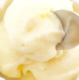 Delicious pineapple sorbet served in a bowl with mint leaves