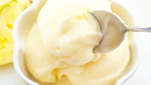 Delicious pineapple sorbet served in a bowl with mint leaves