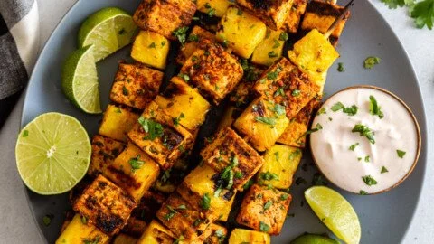 Grilled Pineapple Tofu Skewers with colorful vegetables on a plate