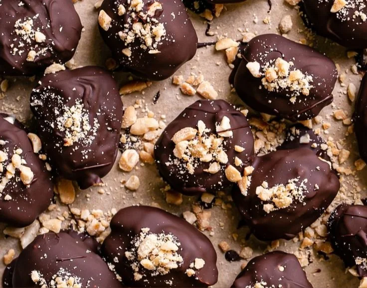 Snickers frozen yogurt chocolate covered date bites on a plate