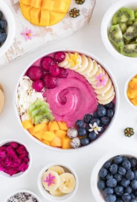 Tropical Pitaya Smoothie Bowl topped with fresh fruits and granola