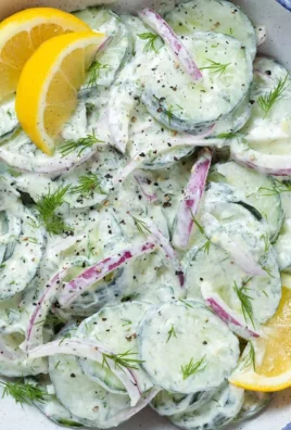 A bowl of Tzatziki Cucumber Salad with fresh cucumbers and herbs